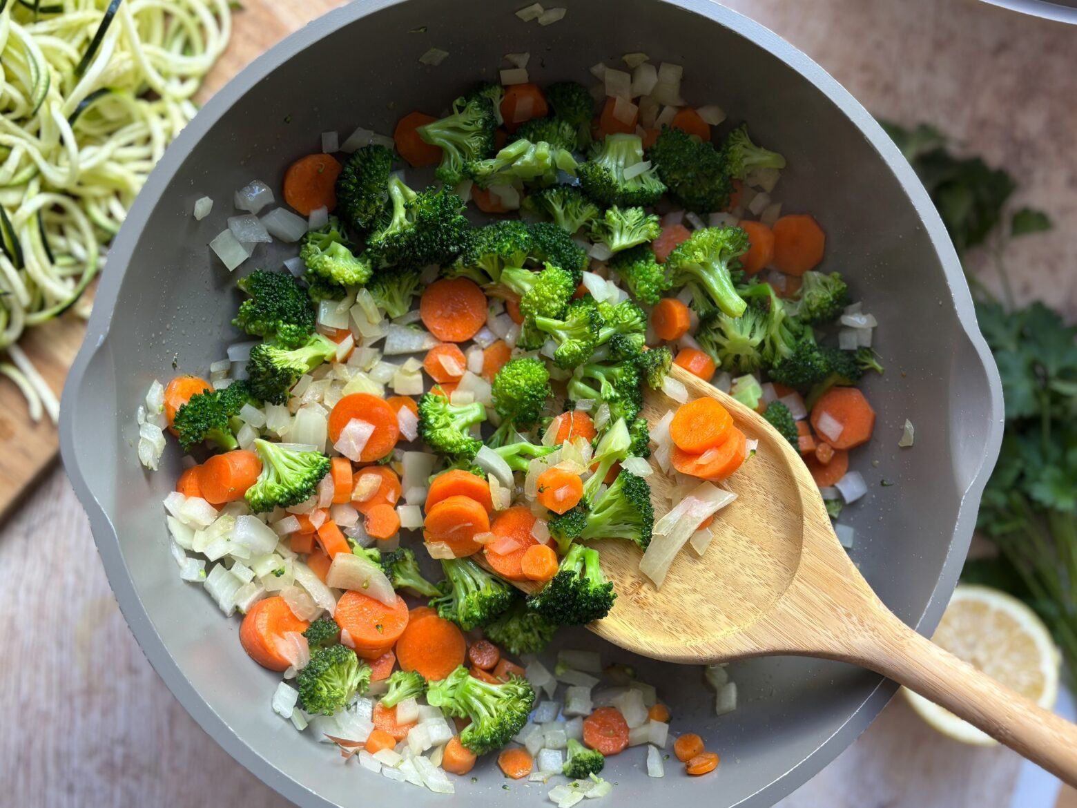 Tuna casserole being prepped in a pan over the stove.