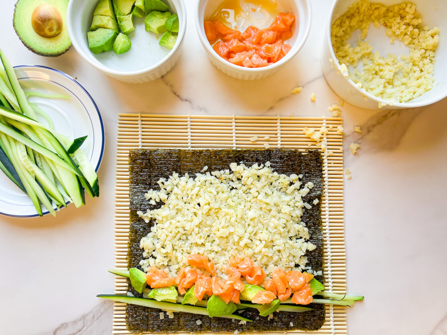 Paleo sushi roll prep with a bamboo rolling matt.