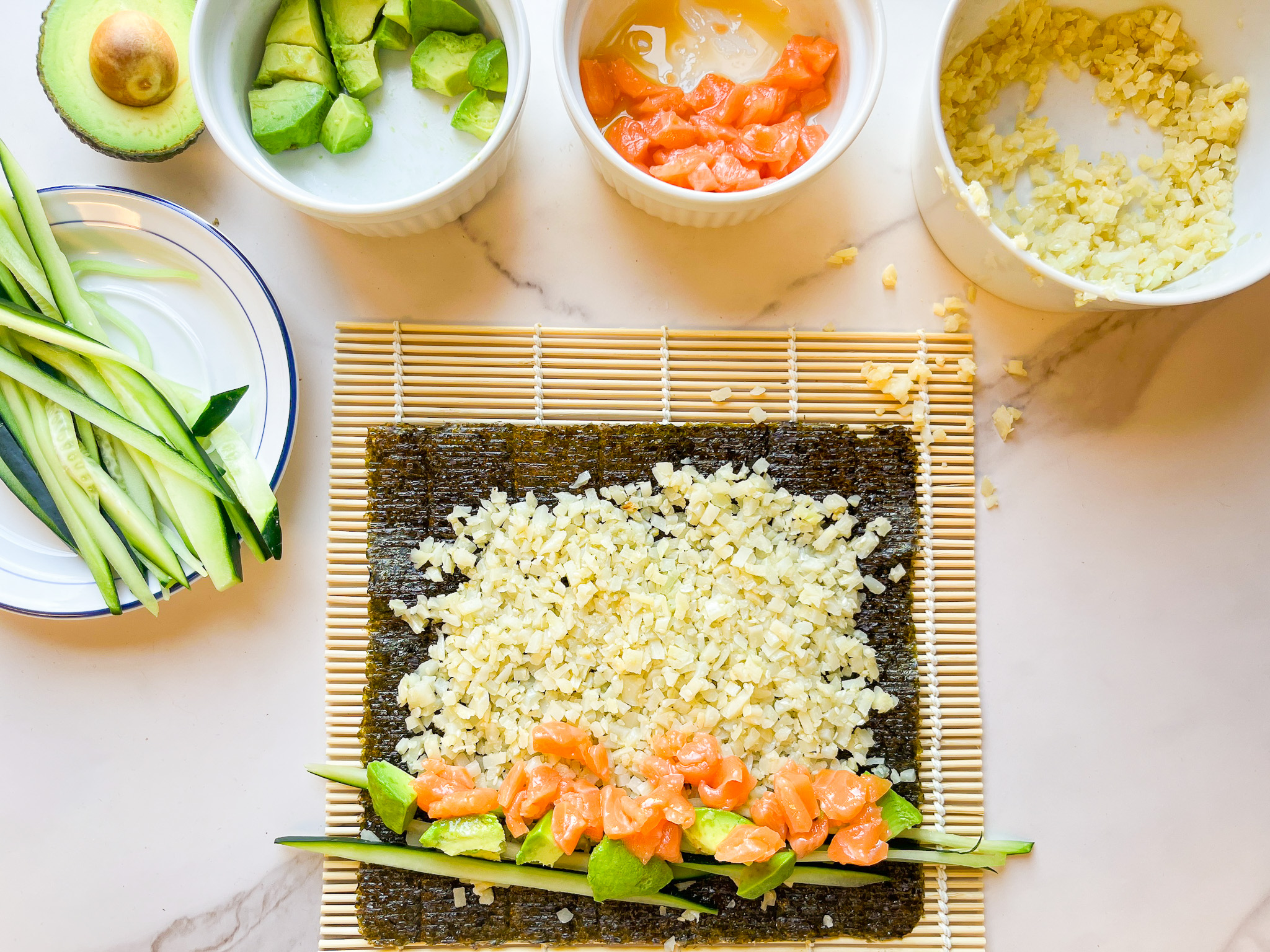 Paleo sushi roll prep with a bamboo rolling matt. 