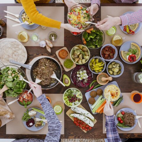 Overhead shot of people eating a healthy dinner