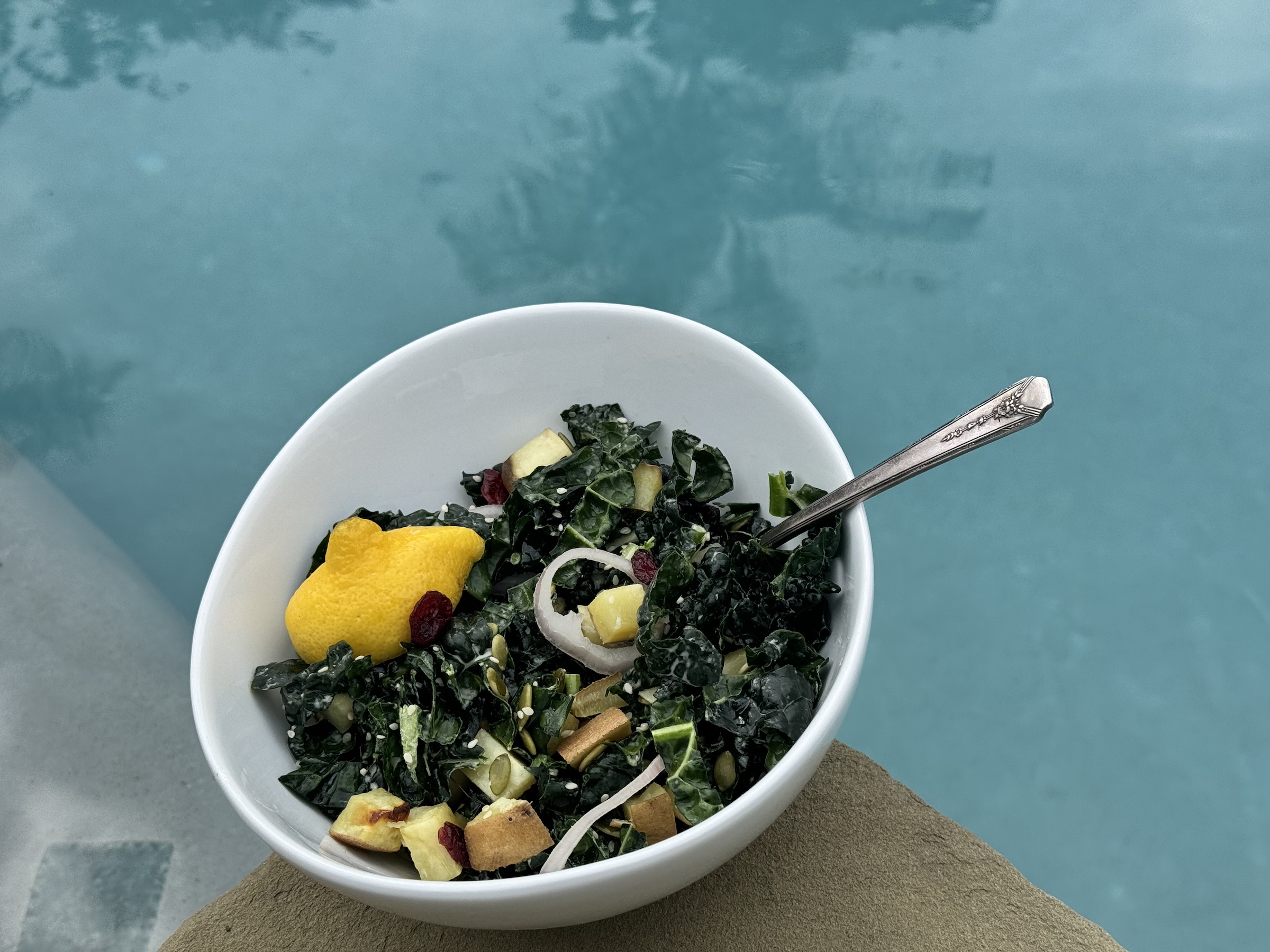 Kale and sweet potato salad finished, near the pool. 