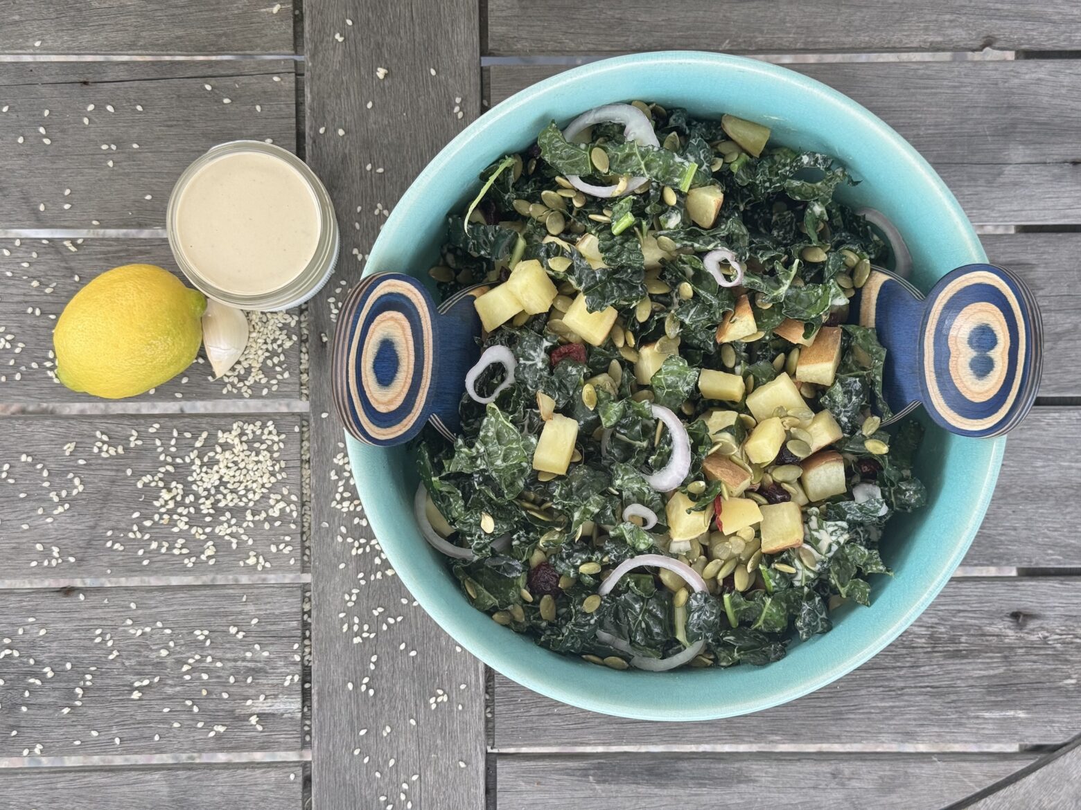 Kale and sweet potato salad finished with dressing.