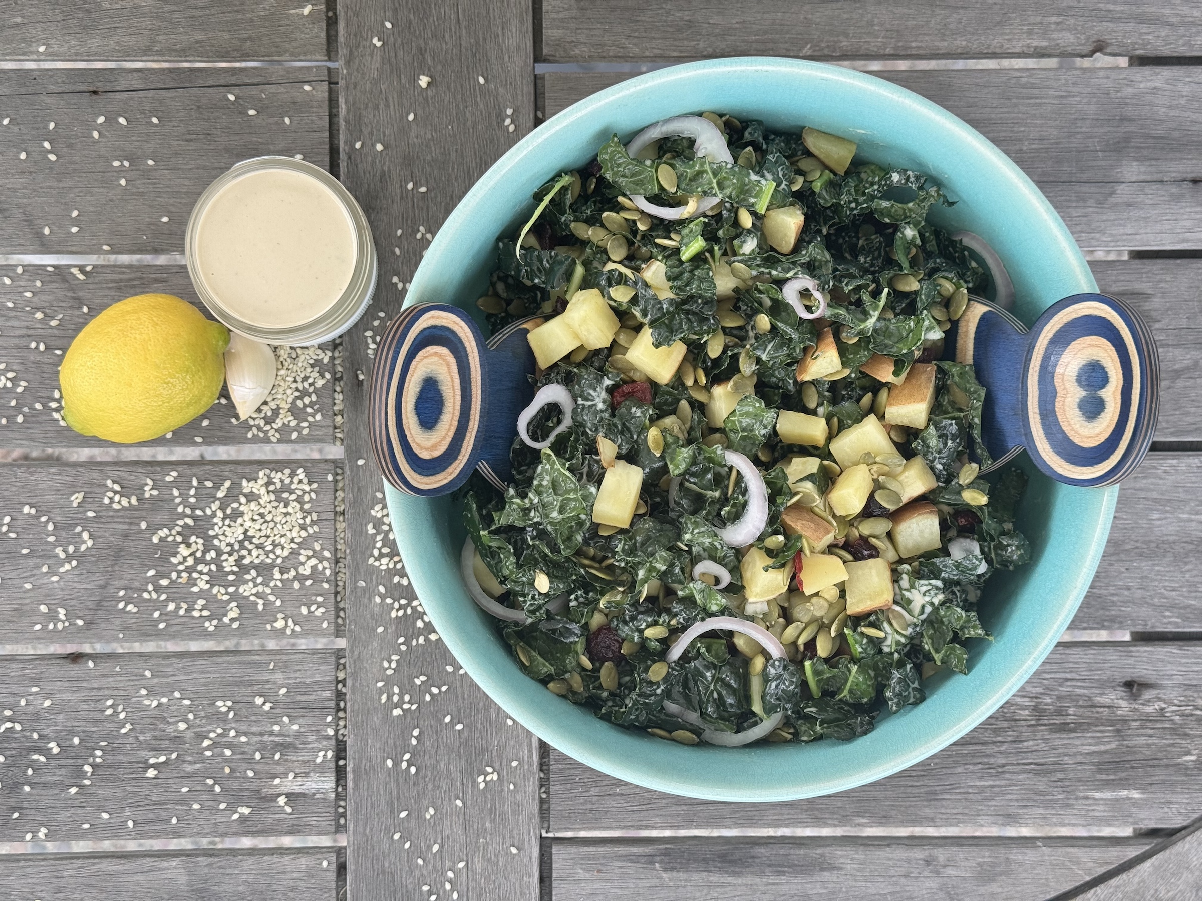 Kale and sweet potato salad finished with dressing. 