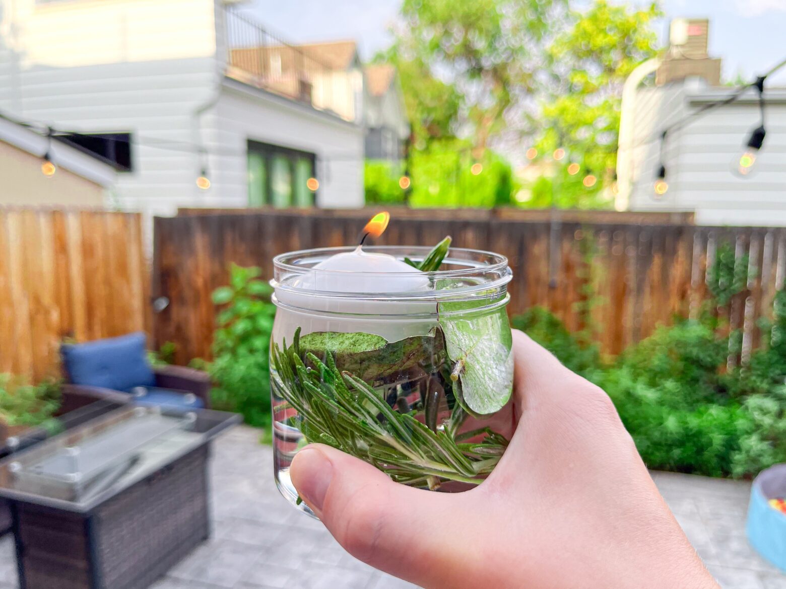 Mosquito repellent candle outside on the patio.