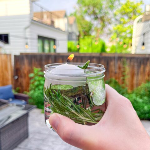 Mosquito repellent candle outside on the patio.