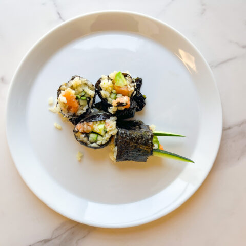 Plaeo sushi roll zoomed out on a plate.
