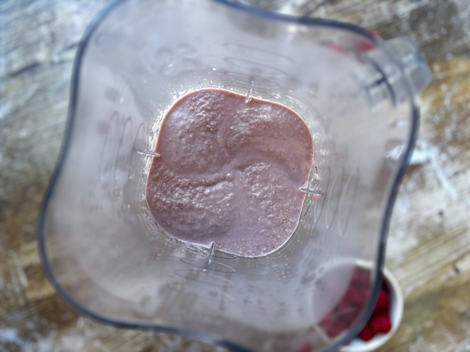 Raspberry mini tart preparation in blender.