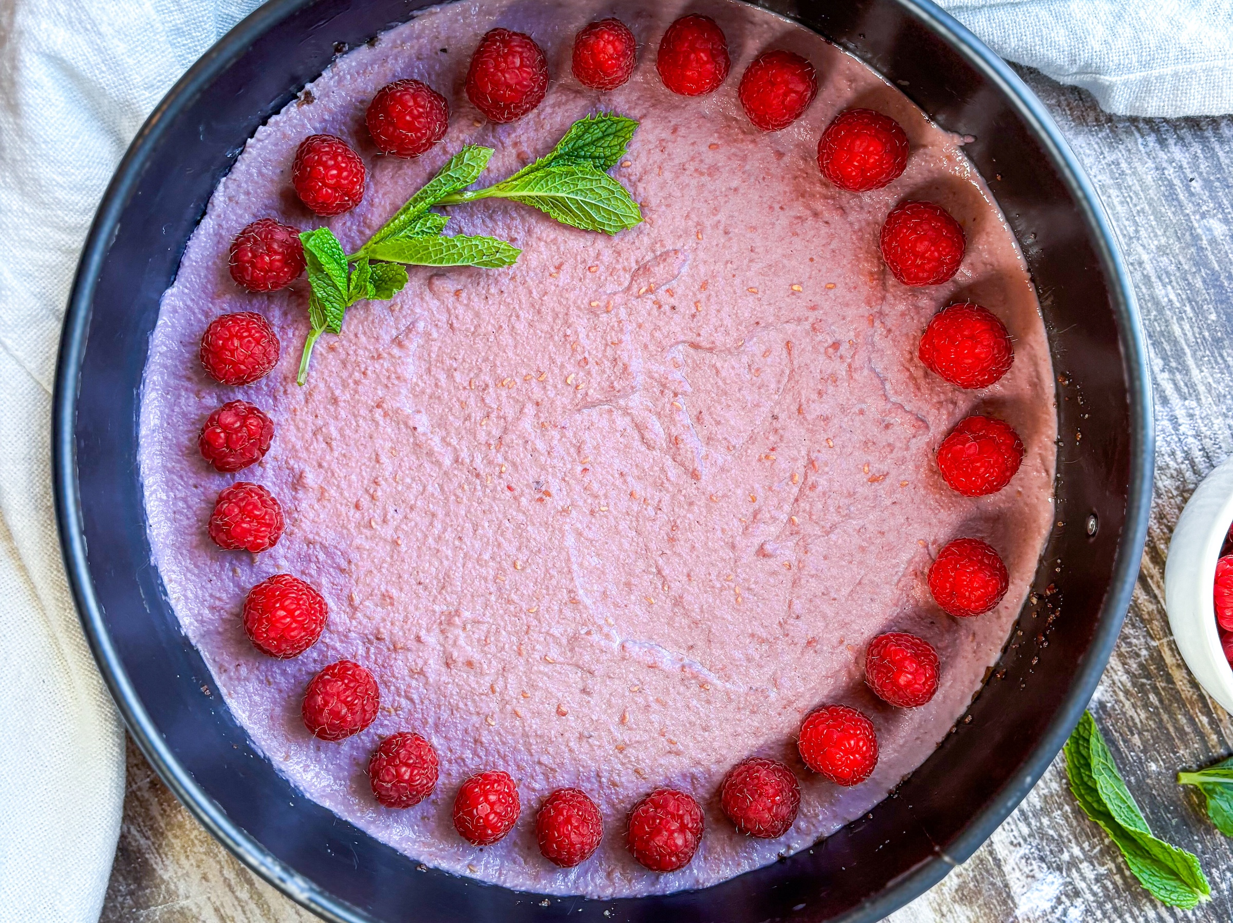 Raspberry mini tart finished, in cake tray.