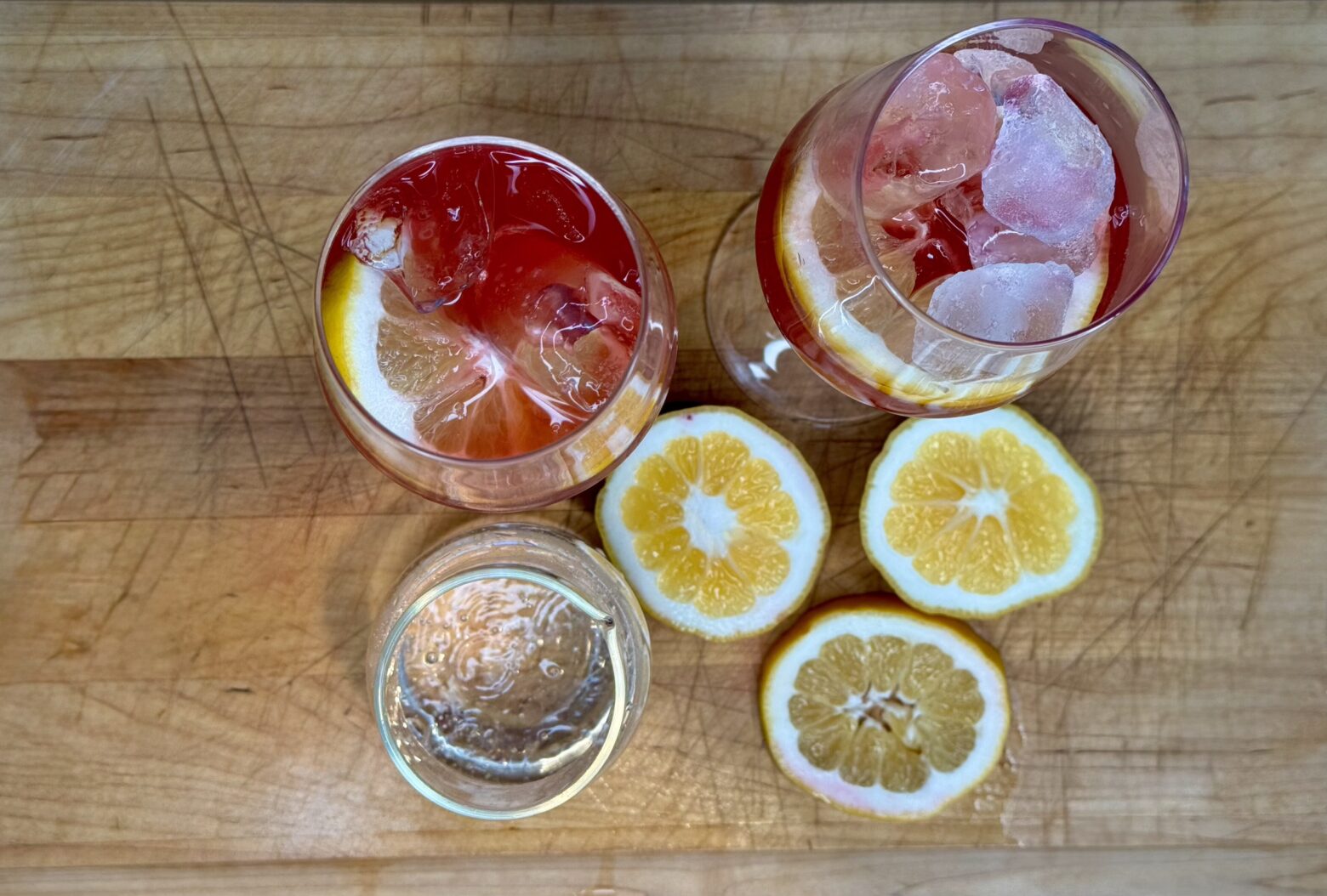 Aperol spritz finished on a cutting board.