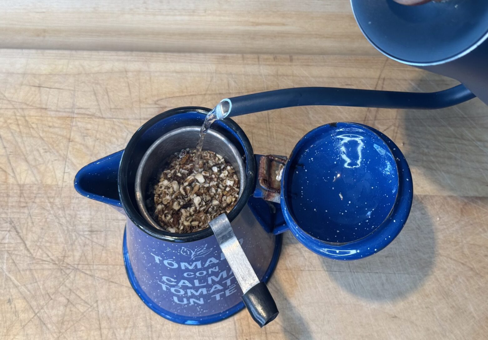 Aperol spritz prep in hot water.