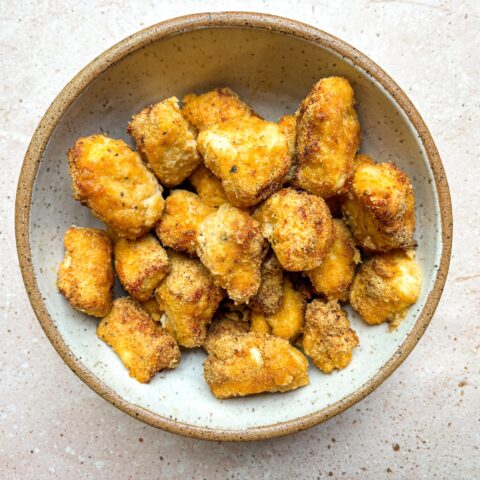 Baked chicken bites finished in a bowl.