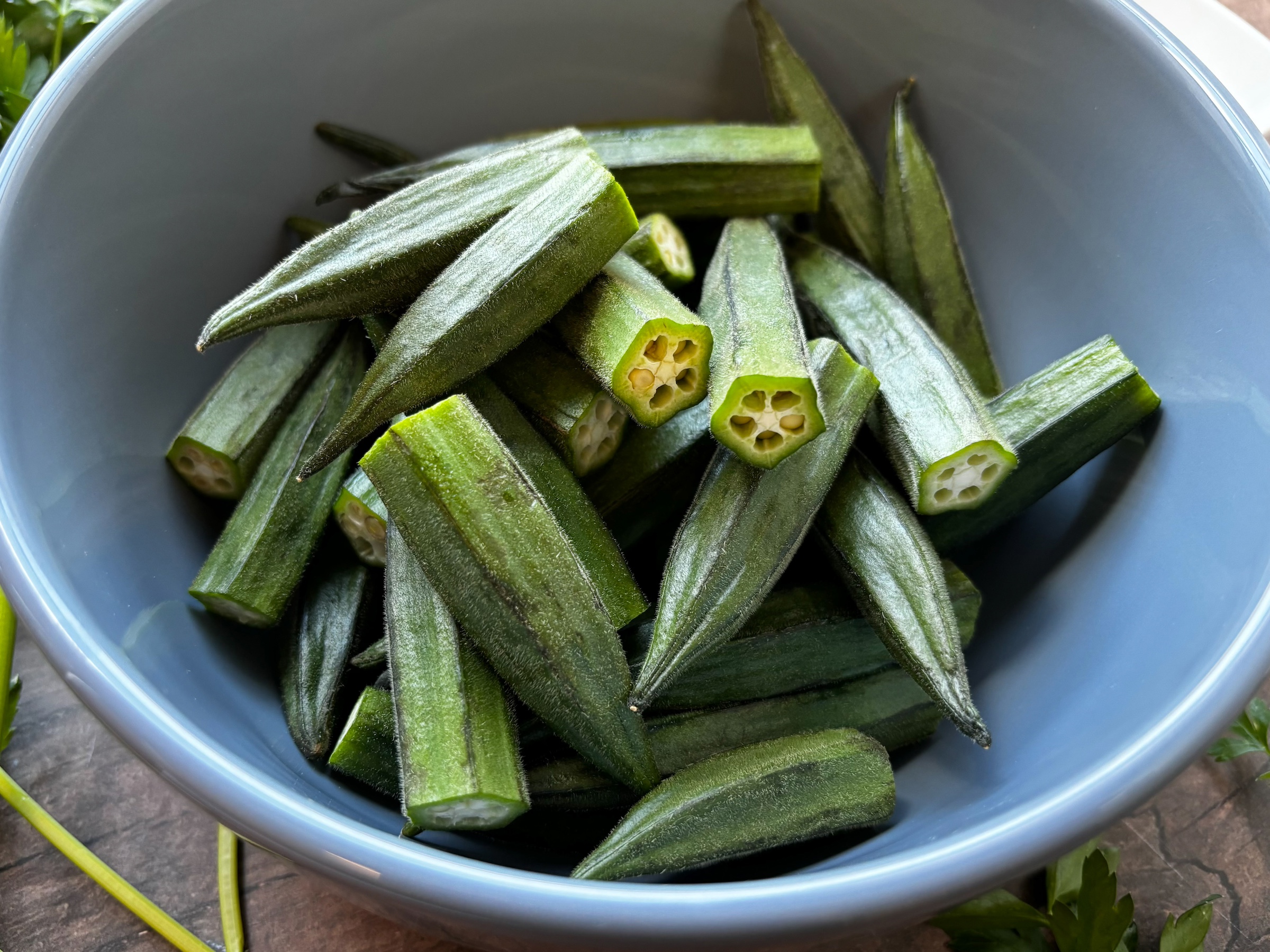 Baked okra bites in a bowl, before they were cooked. 
