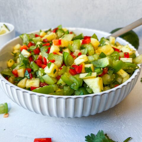 Grilled pineapple salsa verde finished in a bowl.