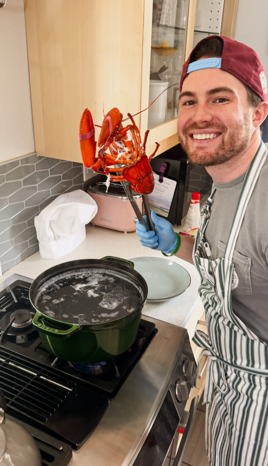 Elliot Baron holding a live lobster.
