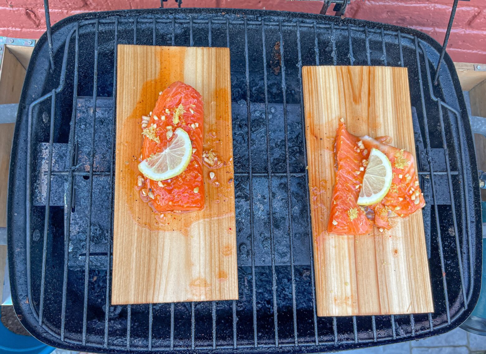 Cedar plank grilled salmon ready to cook on the grill.