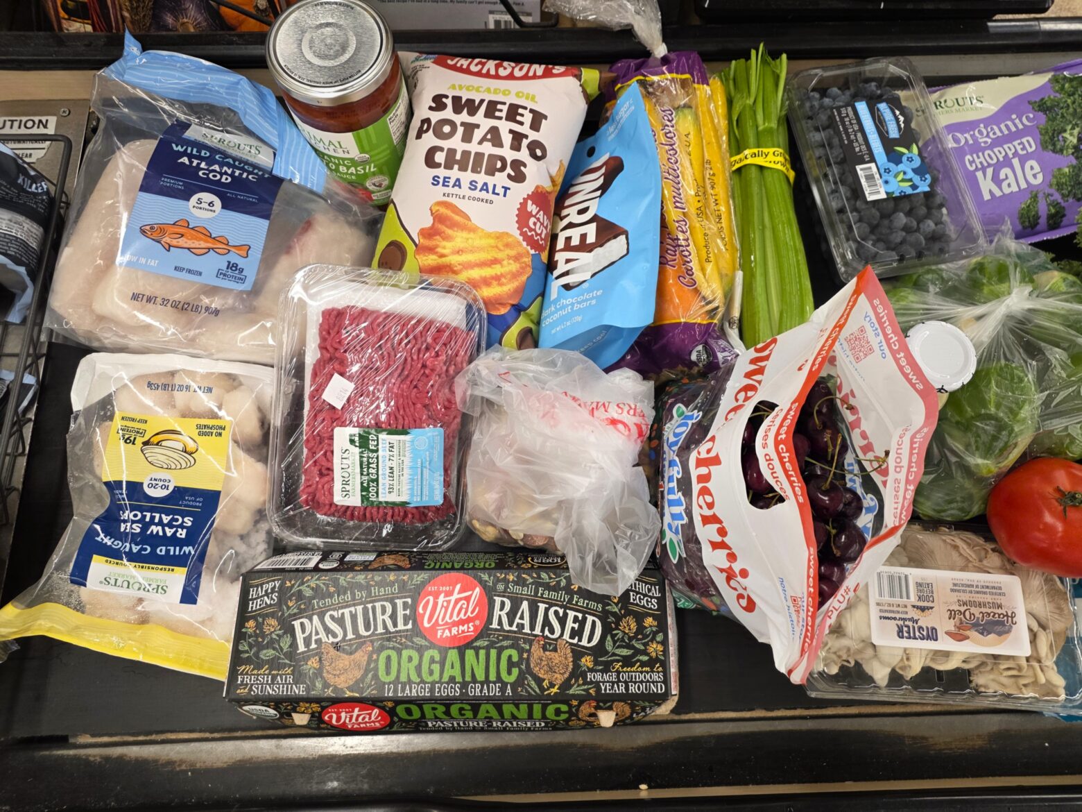 Overhead shot of healthy groceries on a conveyor belt
