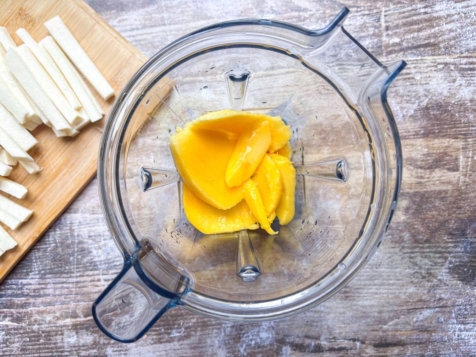 Ingredients for mango dip in a blender