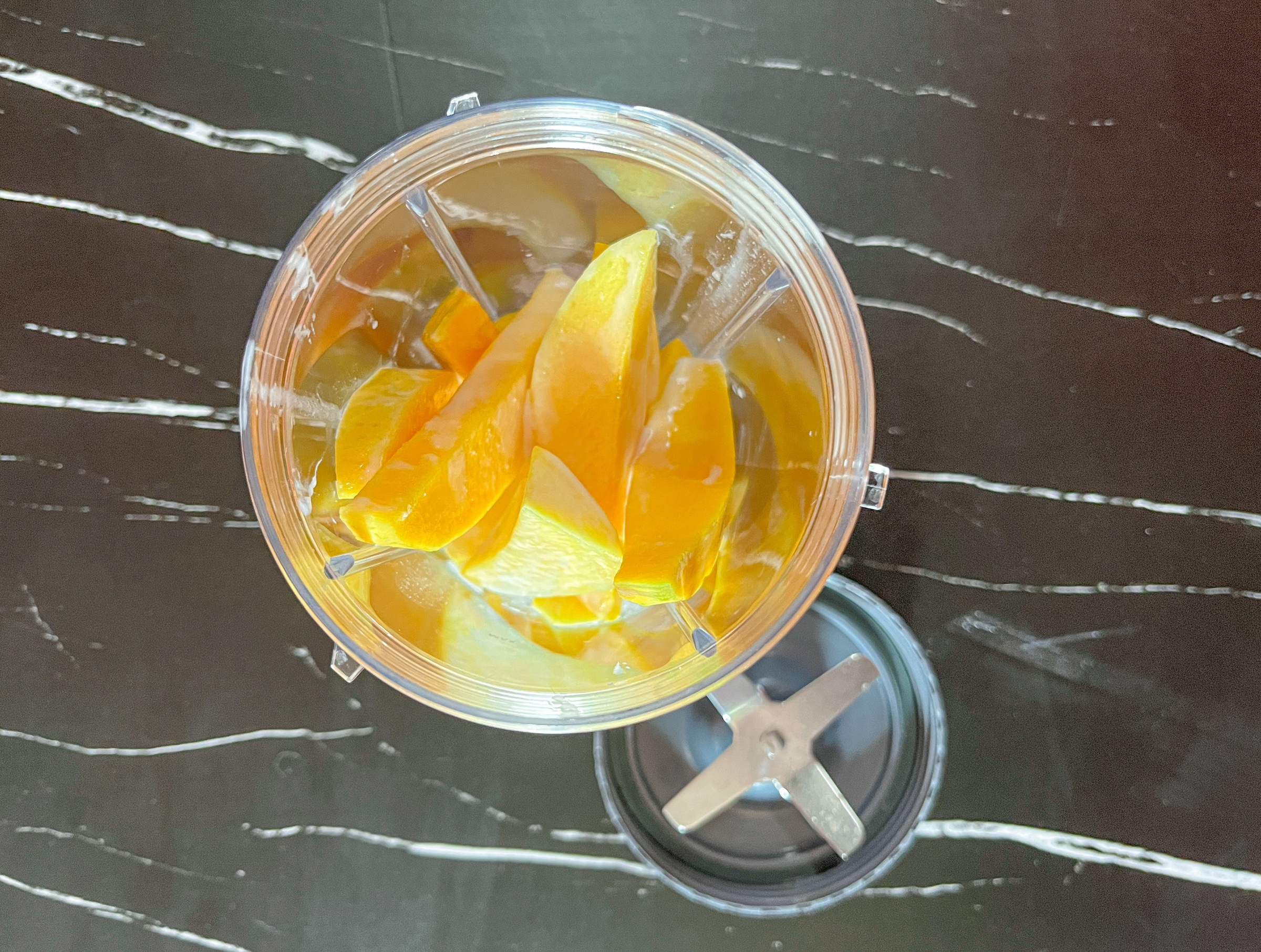 Mangos, coconut milk, and lime juice in a blender. 