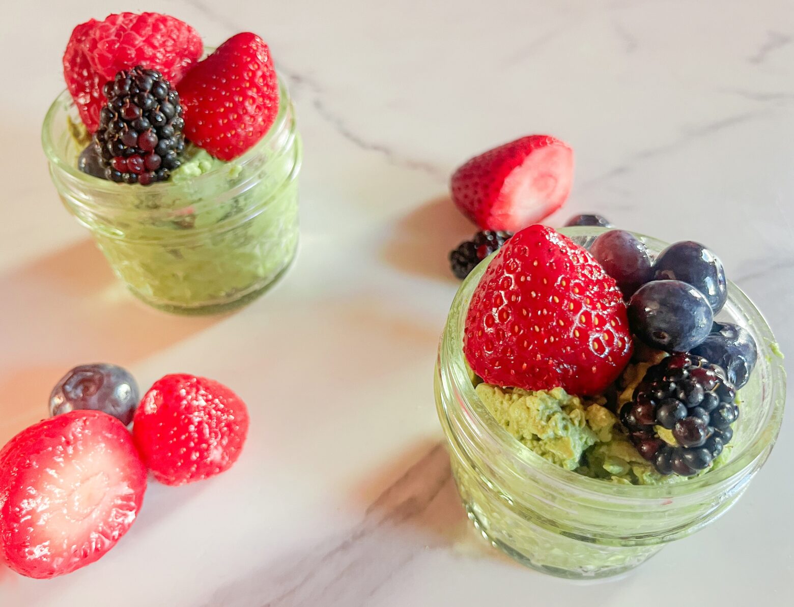 Matcha pudding finished in two small mason jars.