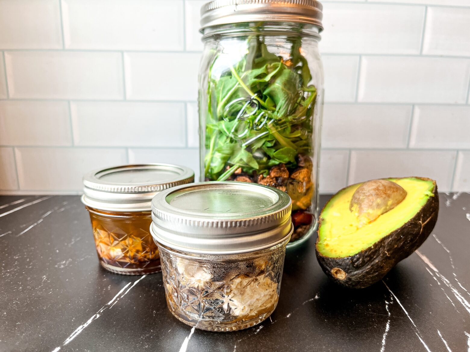 Summer mason jar salad with all the parts, in jars.