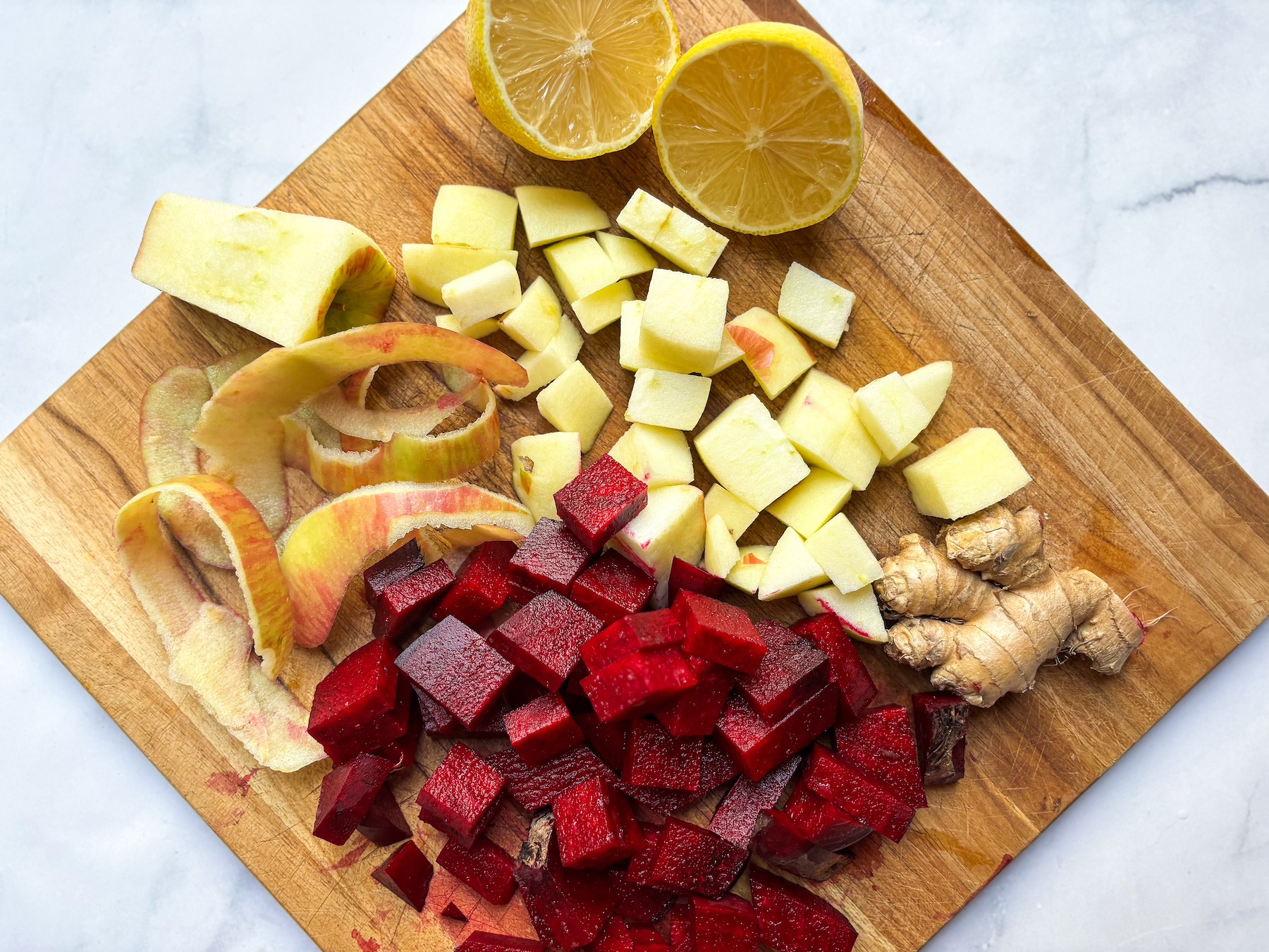 Beet juice ingredients on a cutting board, being prepped. 