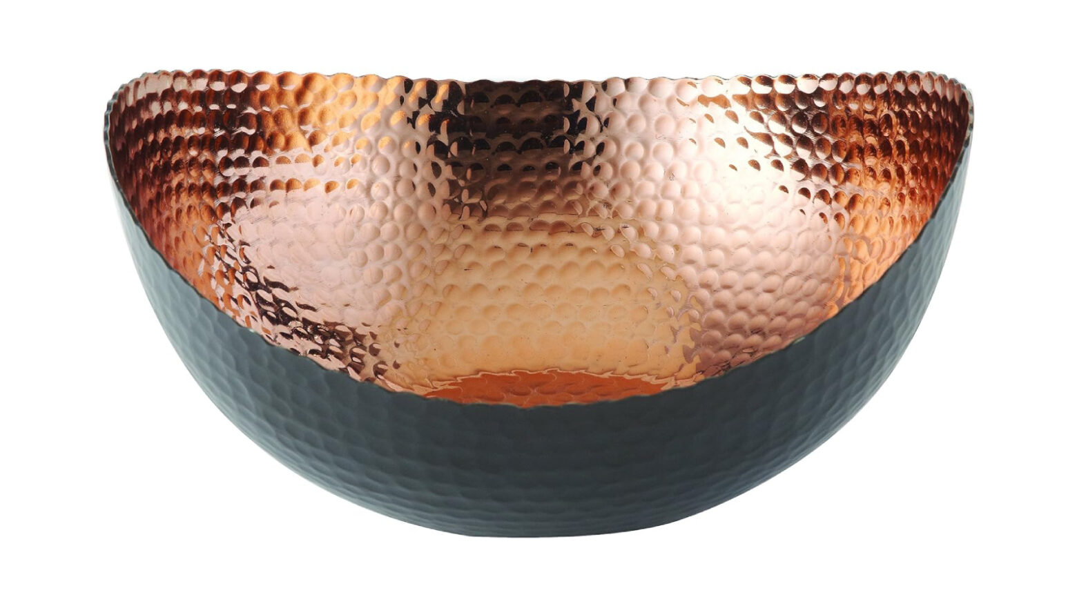 Oblong bowl with matte black exterior and hammered copper interior.