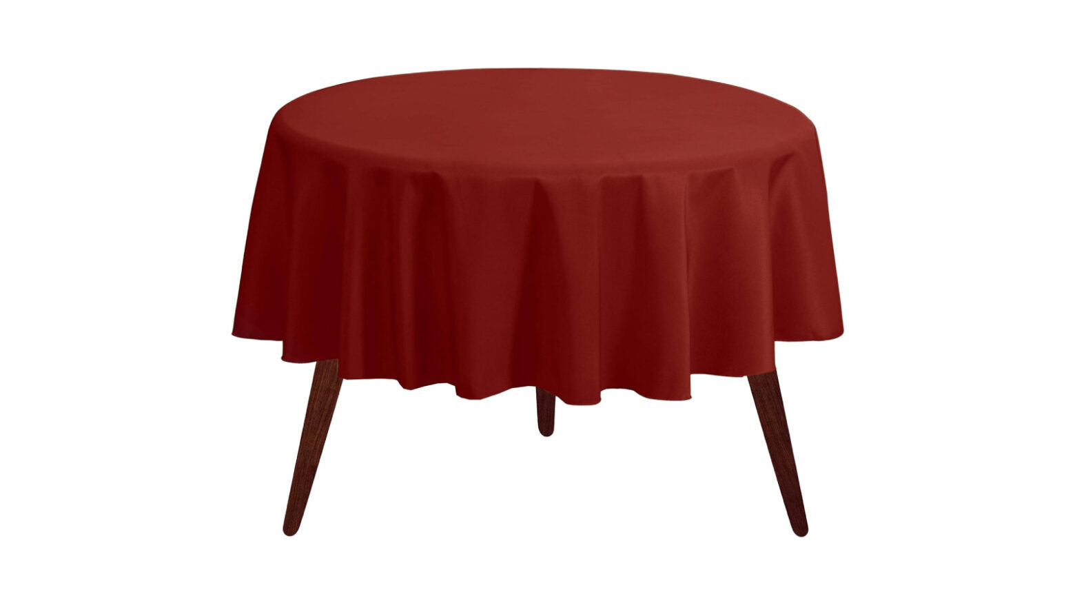 Burnt orange round tablecloth on a table.