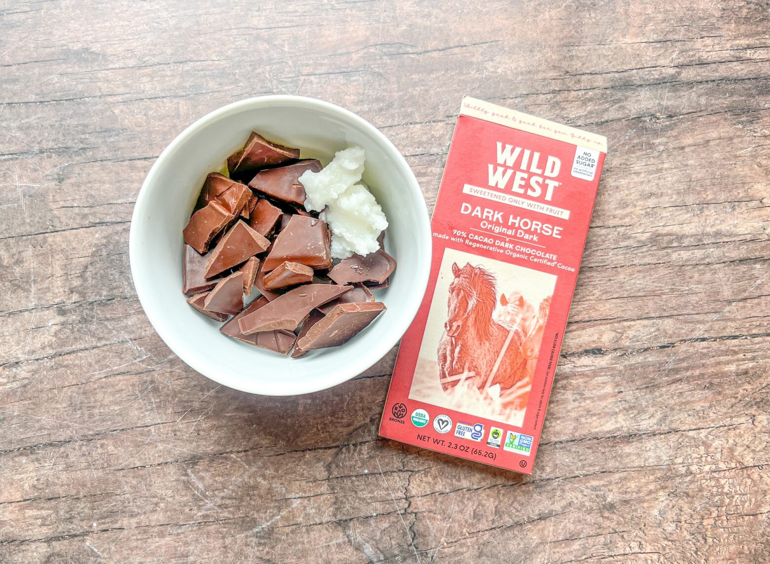 Homemade brownie bars prepping the chocolate frosting.