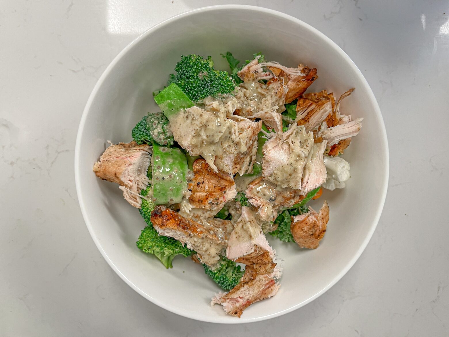 An above shot of a quick lunch salad finished, unmixed.