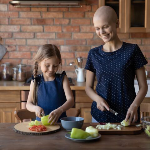 A mother and child preparing a healthy lunch together