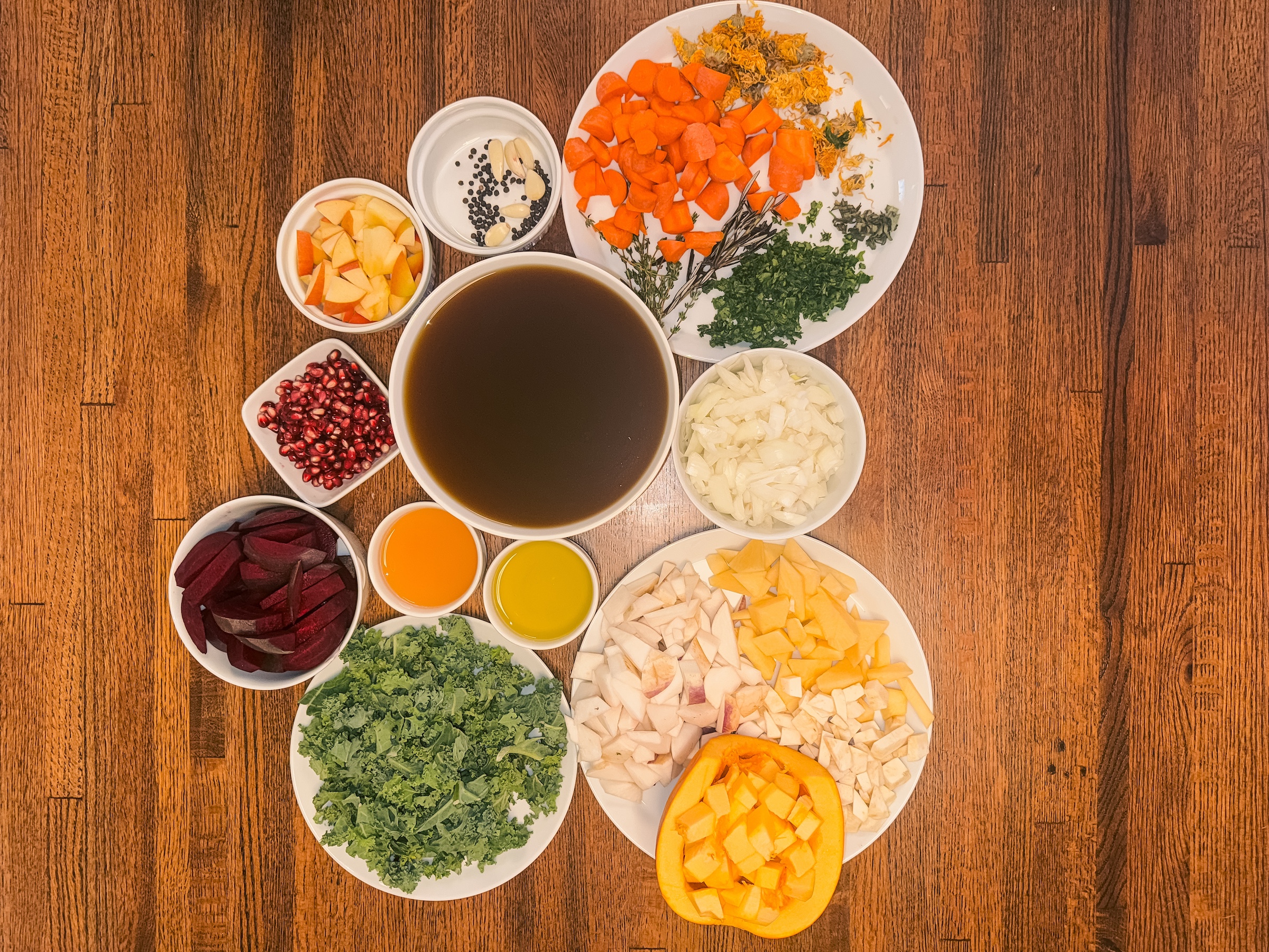 Paleo autumn stew ingredietns chopped in bowls.
