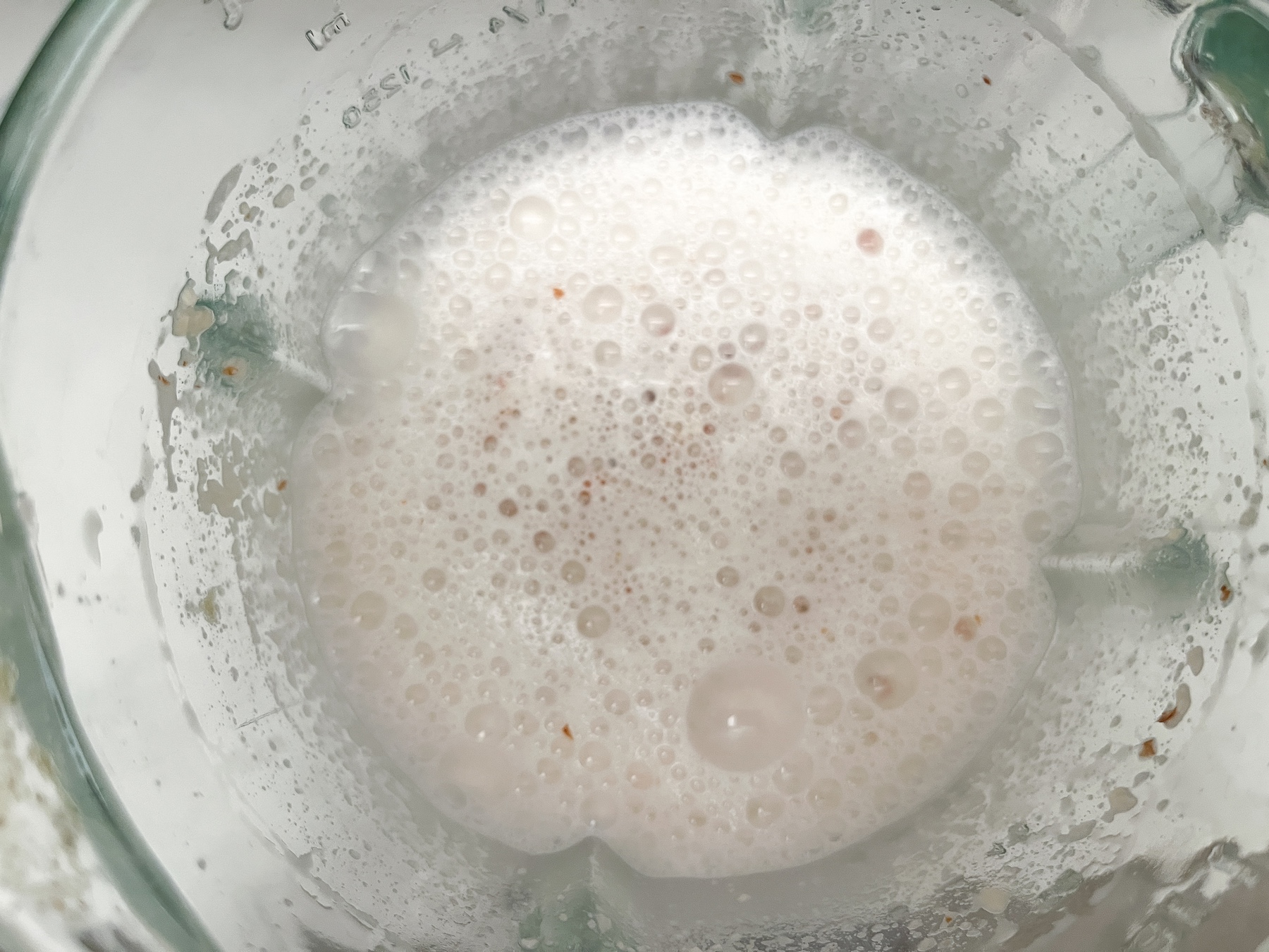 Apple pie spiced almond milk in a blender from above.