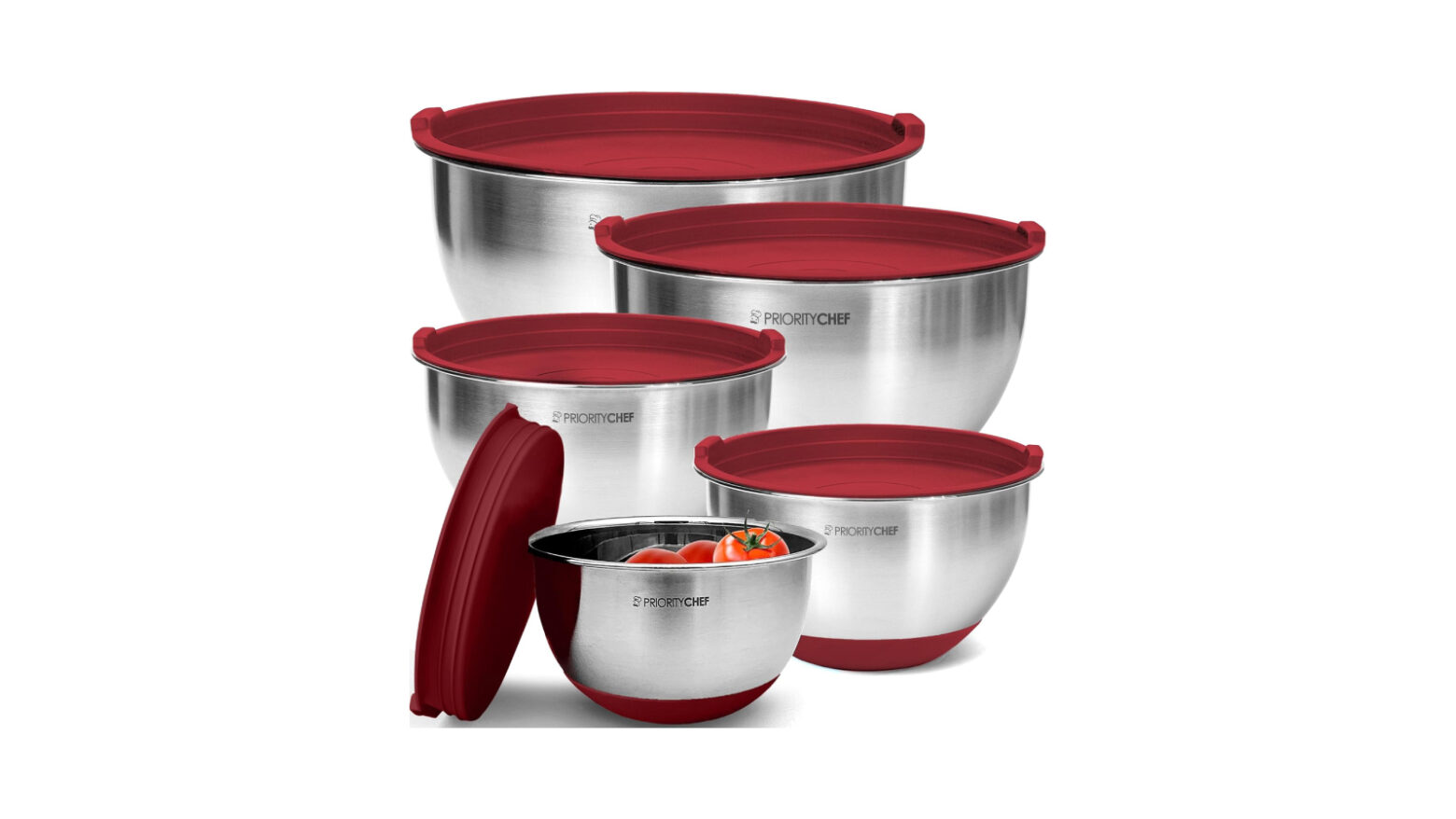 Different sizes of metal bowls with red lids.