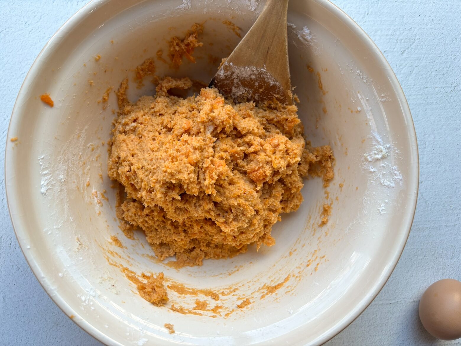 Sweet potato gnocchi being made in a bowl.