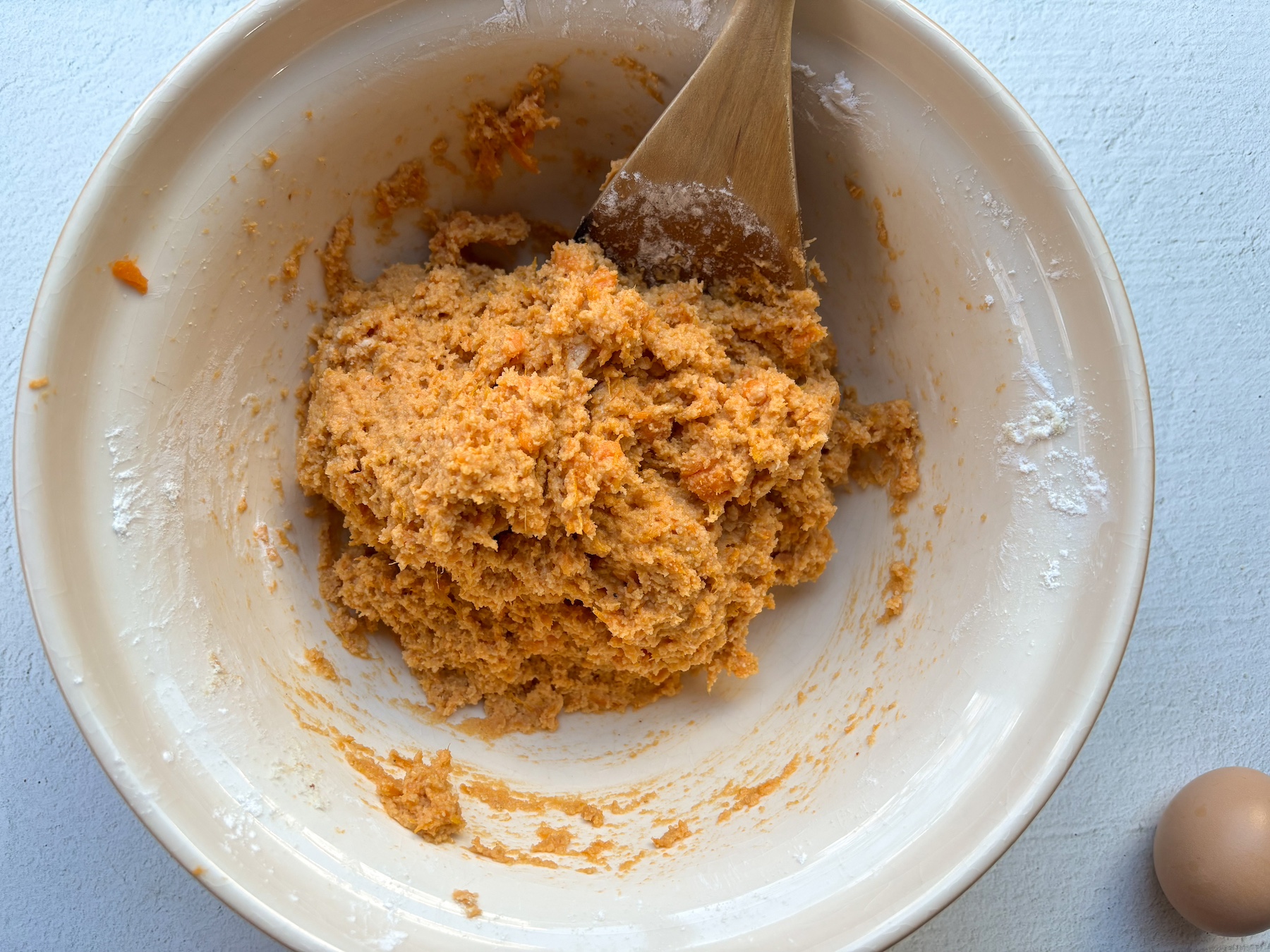 Sweet potato gnocchi being made in a bowl.