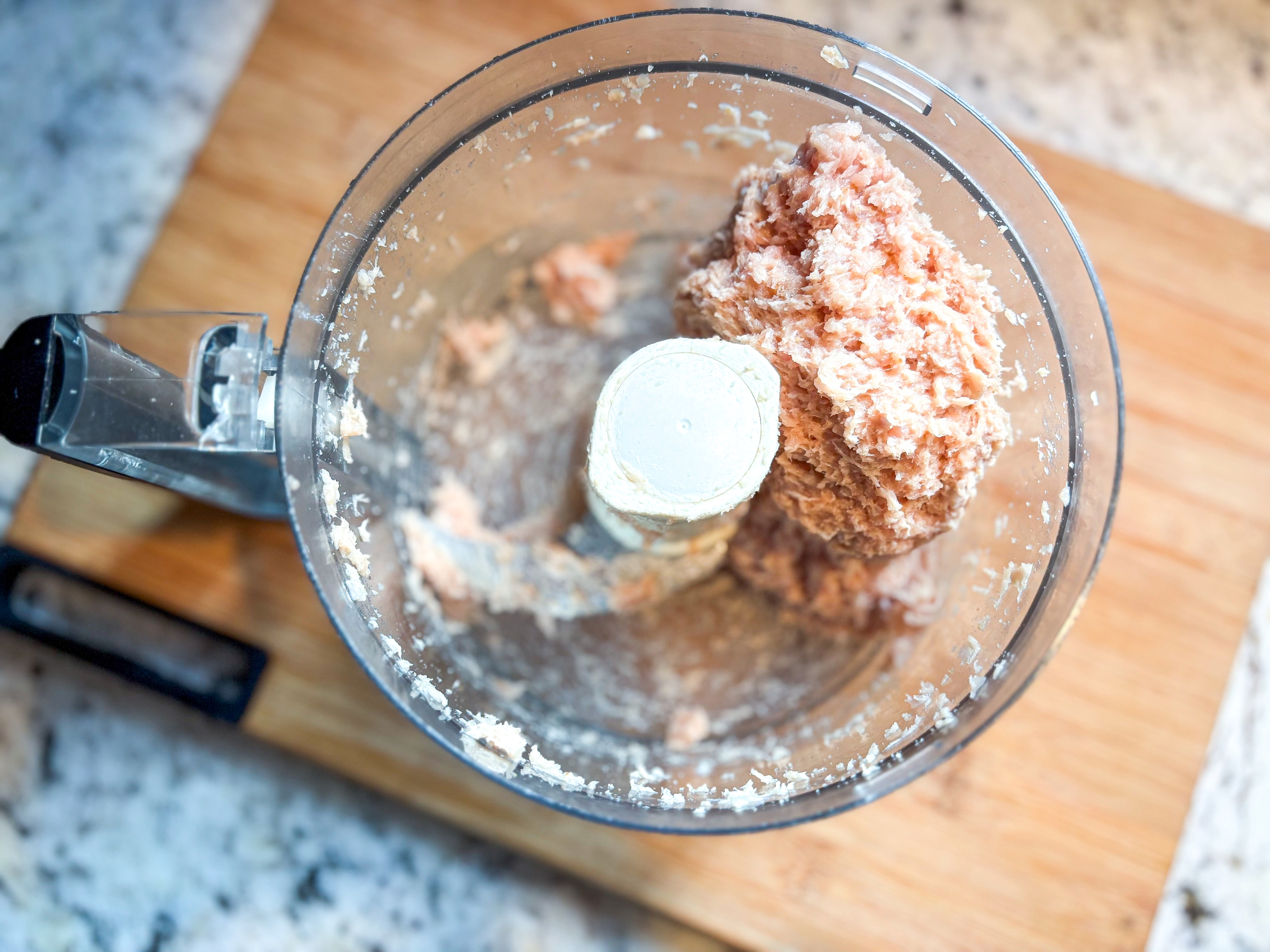 Chicken chip mixture in a food processor.