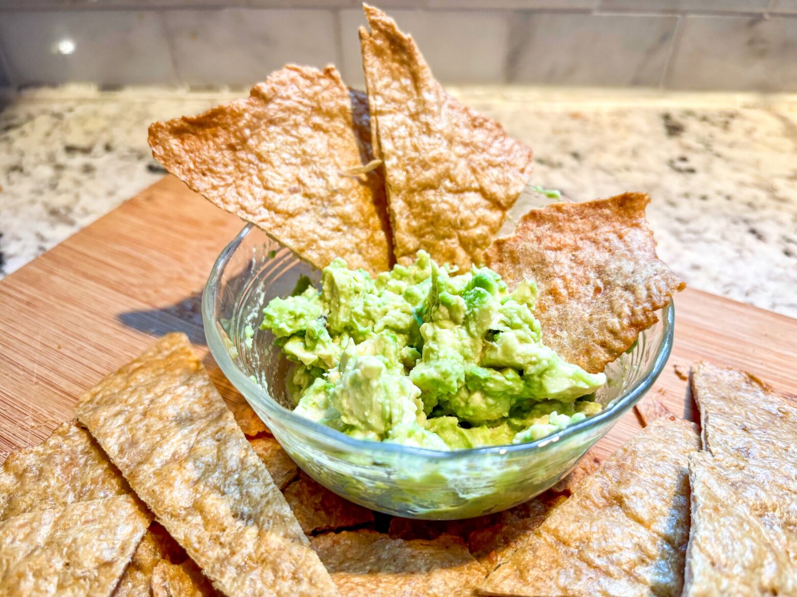 Chicken Chips in a bowl with guacamole.