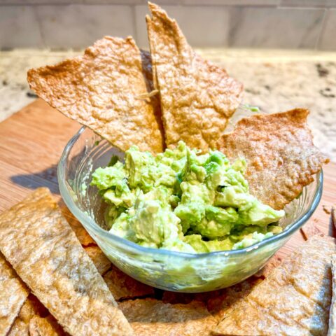 Chicken Chips in a bowl with guacamole.