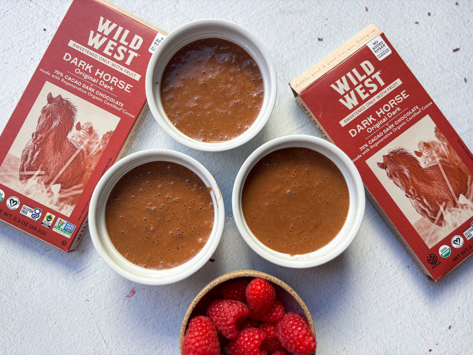Above shot of 3 Chocolate Pots de Creme with Wild West Chocolate packages.