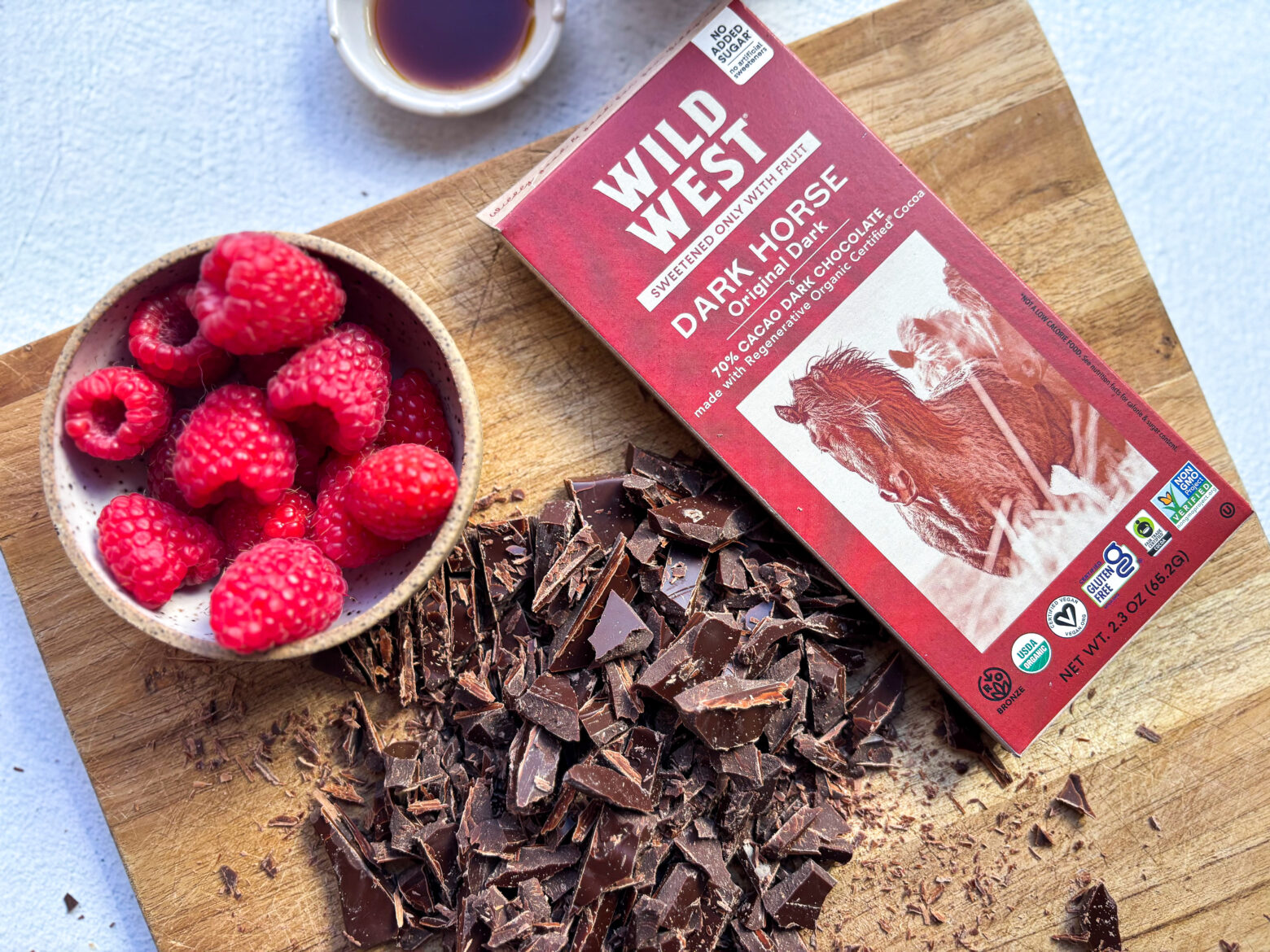 Wild West Chocolate bar chopped on a cutting board with packaging.