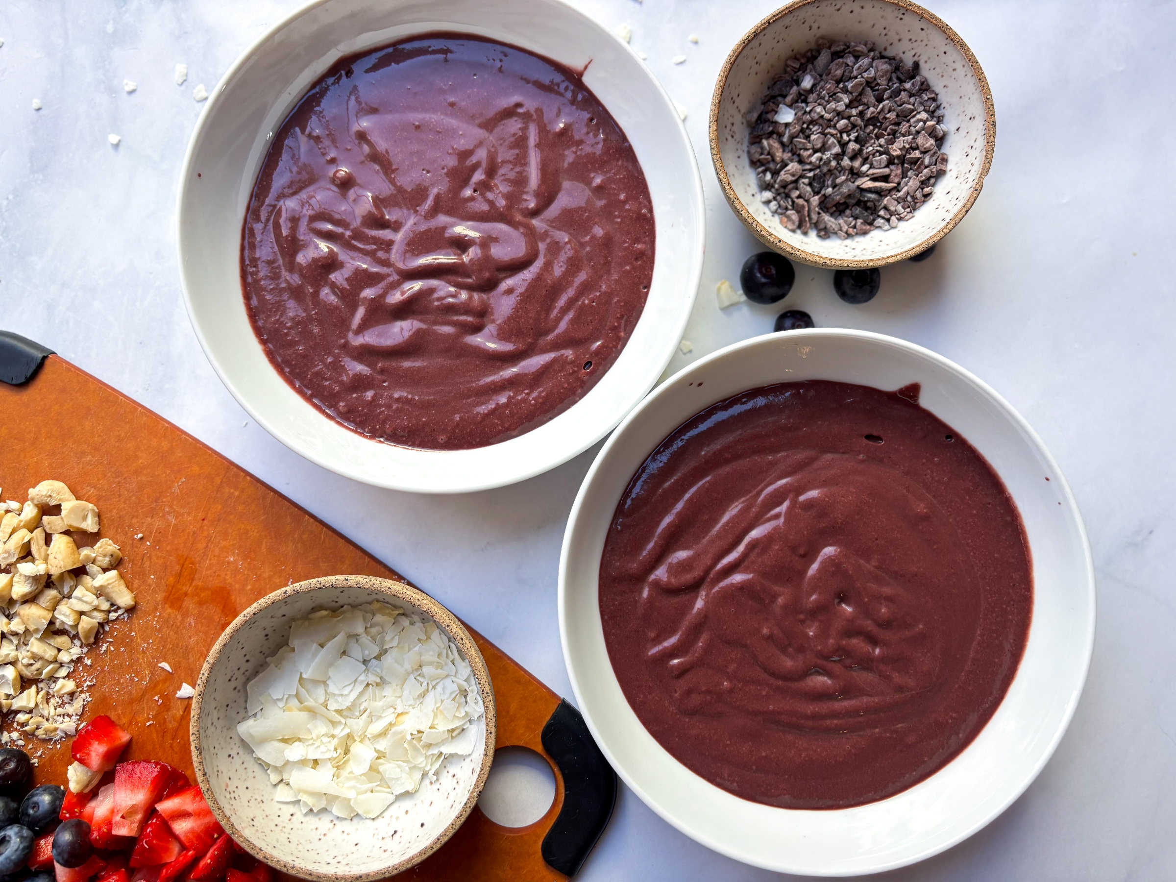 Blended acai puree with prepped ingredients