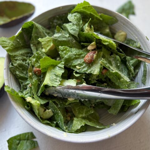 Caesar Salad tossed with Caesar dressing.
