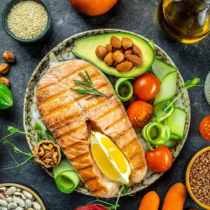 Raw salmon steak with other whole-food ingredients.