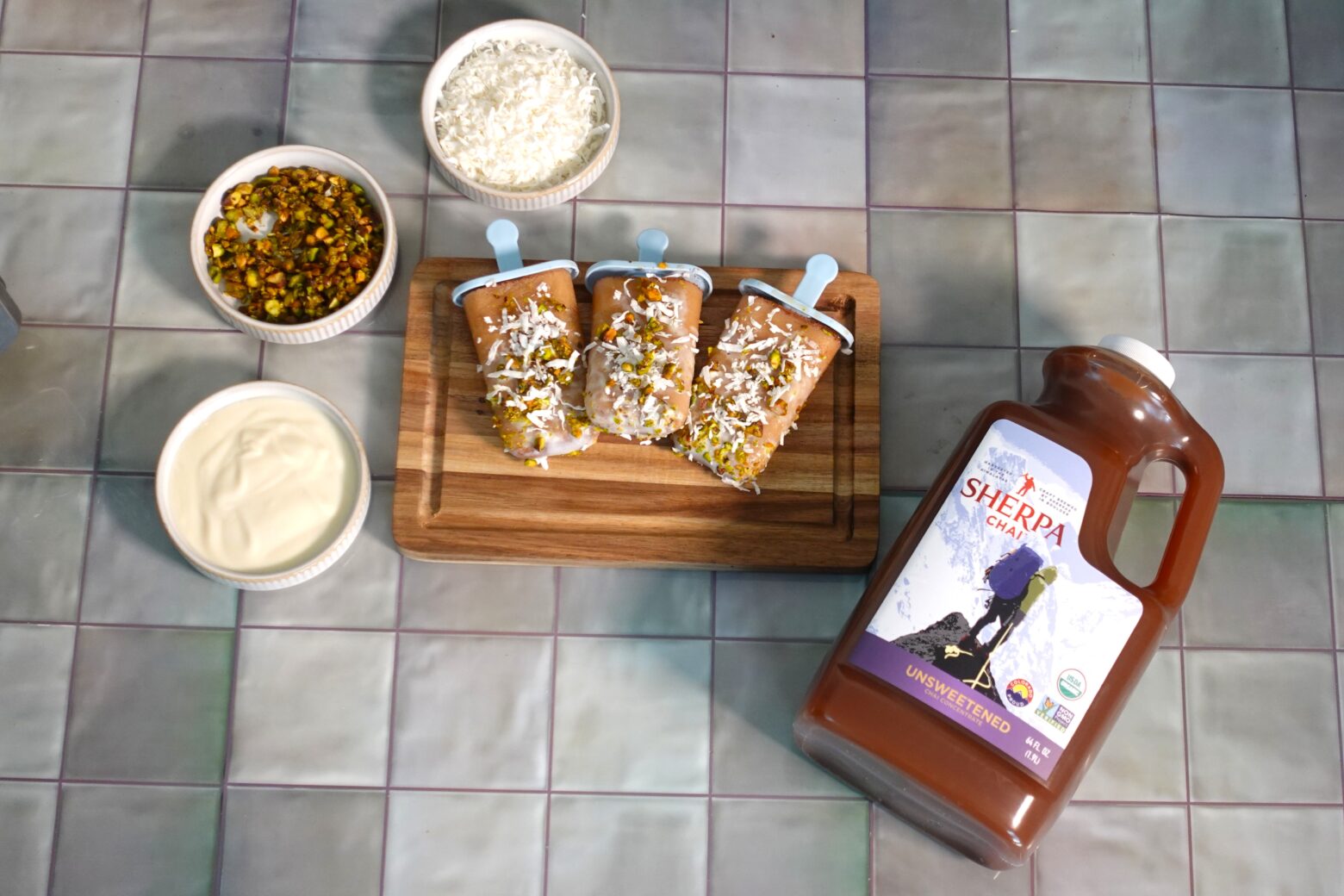 Chai popsicles next to a bottle of Sherpa Chai concentrate.