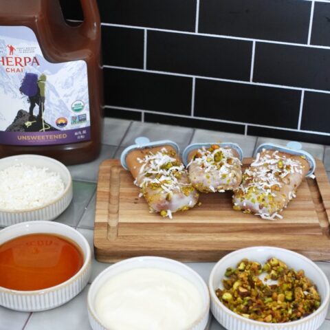 Chai popsicles on a cutting board with ingredients and Sherpa Chai concentrate.