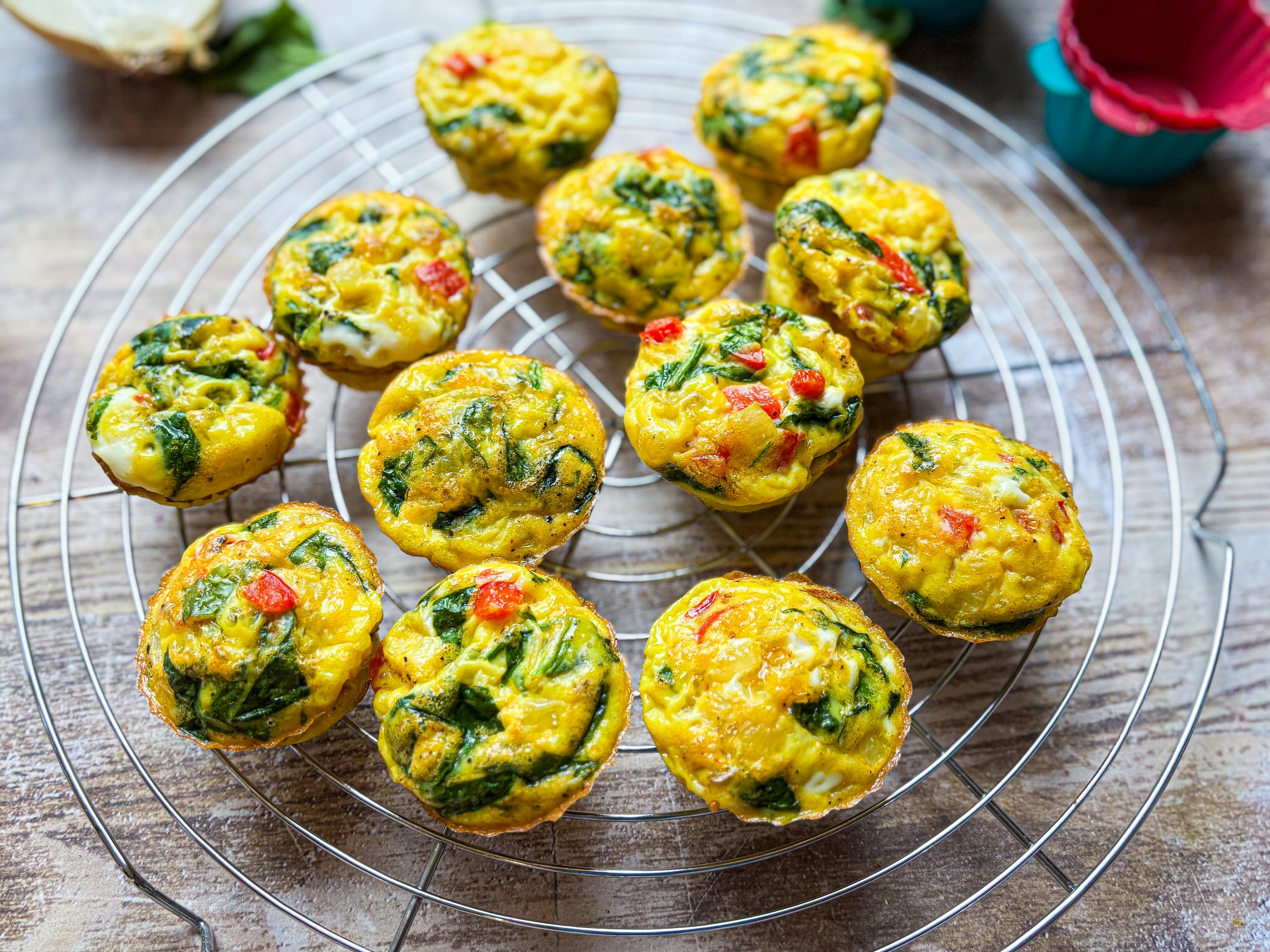 Finished Red Pepper & Spinach Egg Bites on a cooling rack.