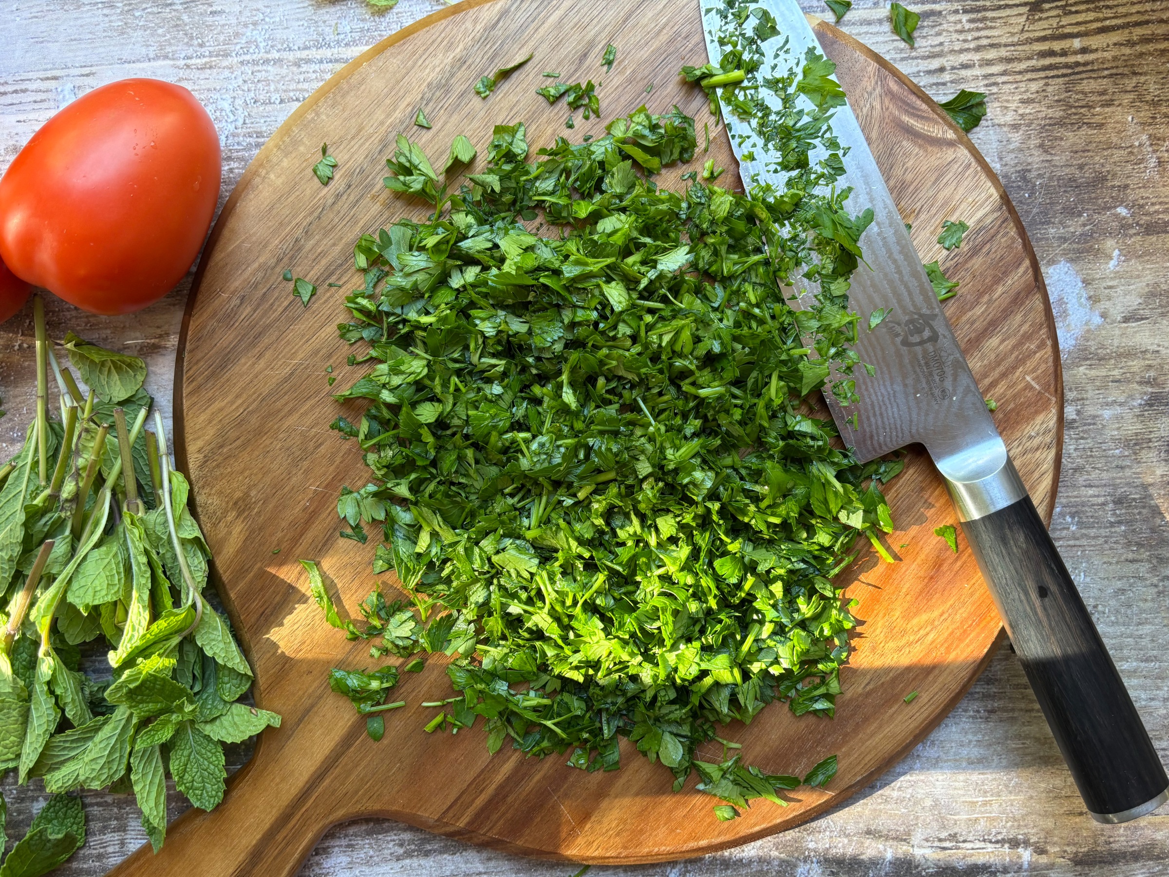 Chopped parsley on a cutting board.