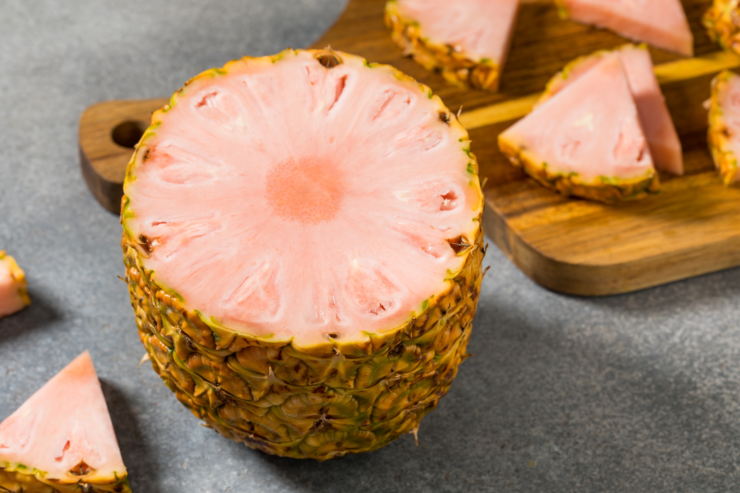 Pink pineapple sliced crosswise.