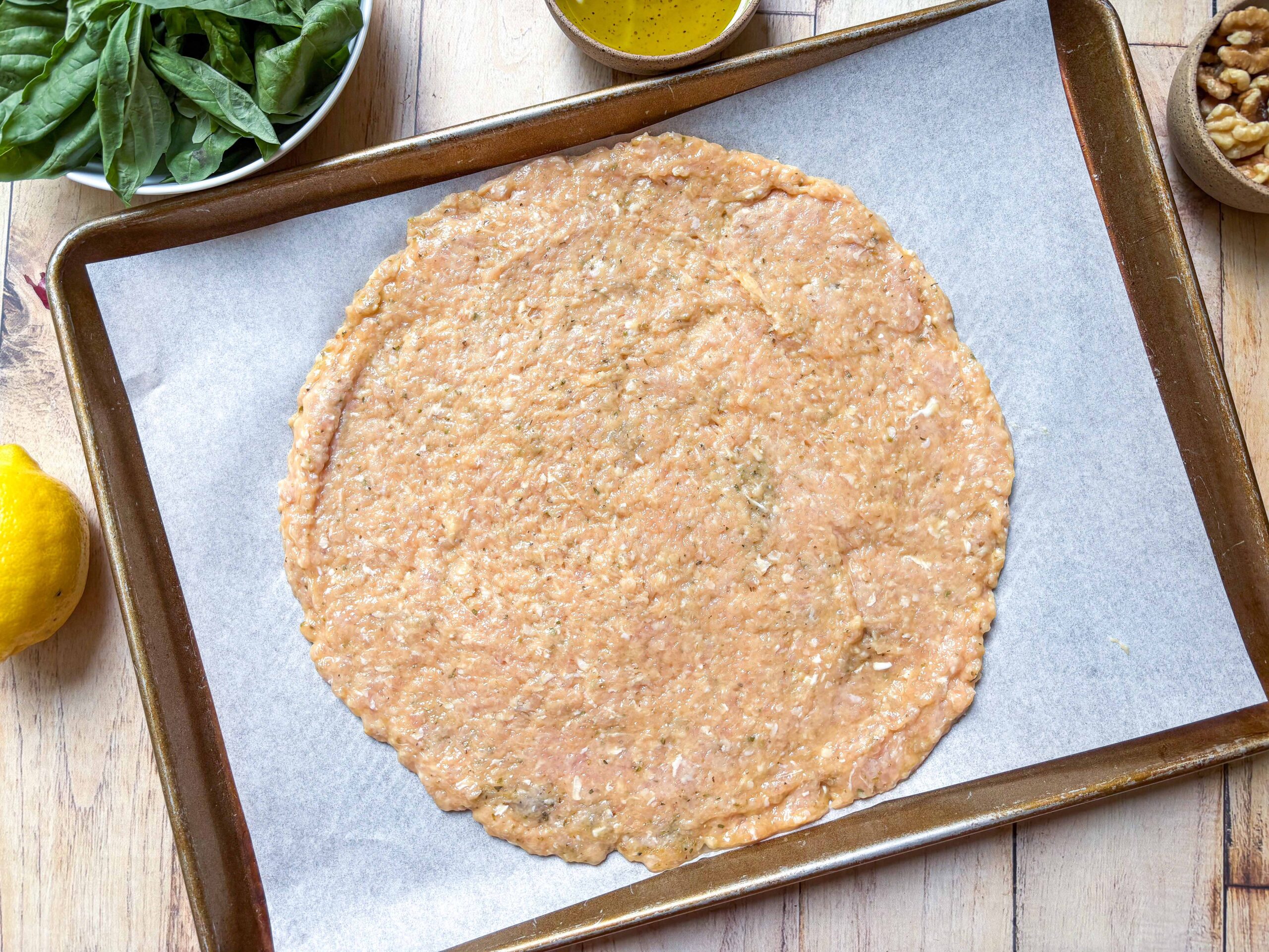 Chicken-crust pizza base prepped