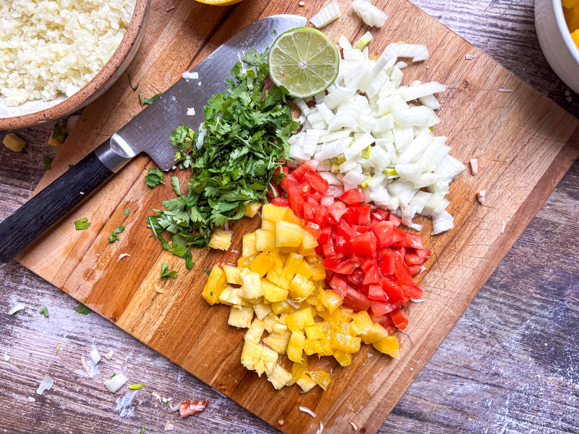 Prepped ingredients for pineapple pico de gallo